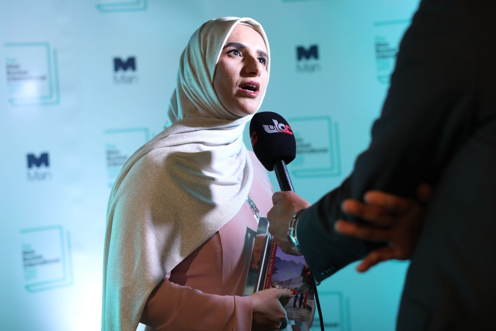 Author Jokha Alharthi being interviewed after winning the Man Booker International Prize on Tuesday. Photo: AFP