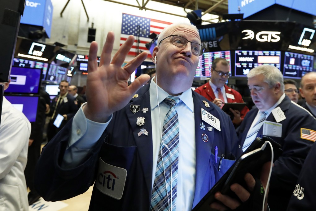 Trader Thomas Ferrigno works on the floor of the New York Stock Exchange on May 17, 2019. The current level of asset prices does not reflect the increasing probability of a protracted trade war. Photo: AP
