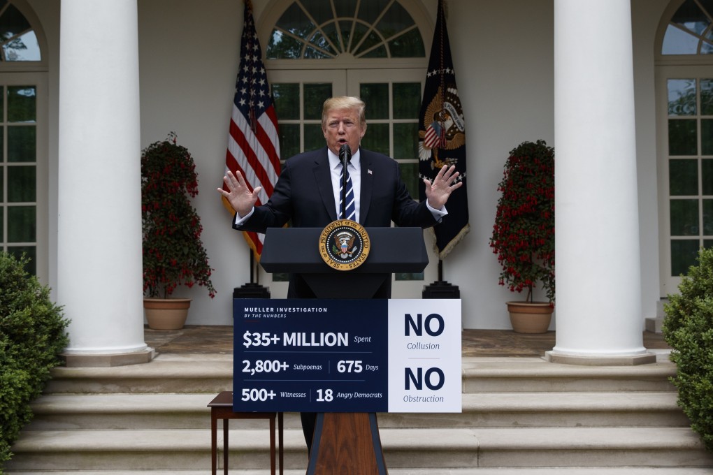 US President Donald Trump delivers a statement in the Rose Garden of the White House on Wednesday, with a sign on the podium declaring that Special Counsel Robert Mueller had found “NO collusion” and “NO obstruction”. Photo. AP