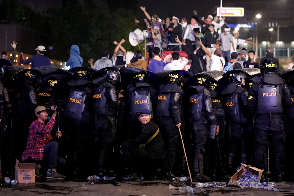 Riot police officers at a riot near the Election Monitoring Body (Bawaslu) headquarters in Jakarta on Wednesday. Photo: Reuters