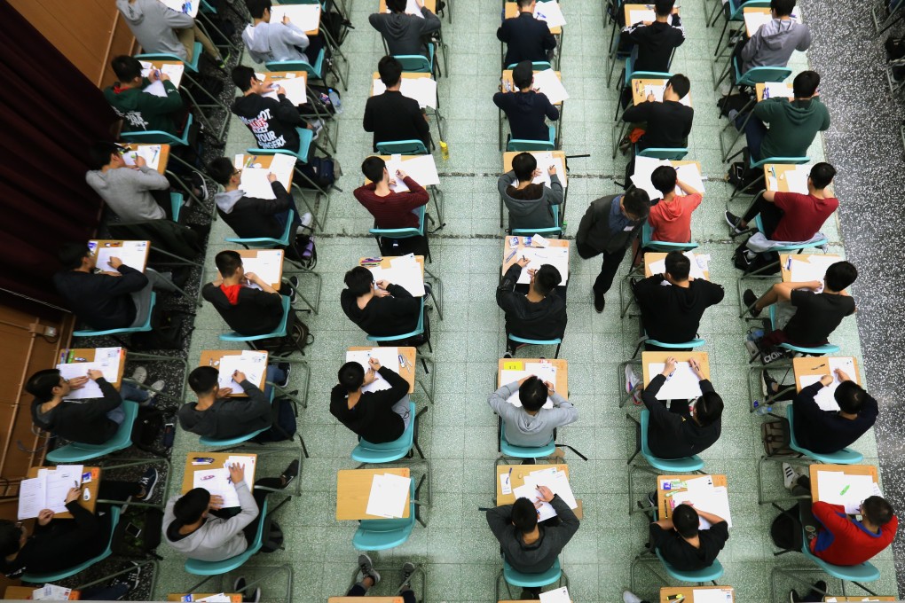 Students hard at work on the first day of the Hong Kong Diploma of Secondary Education exams at the Cheung Sha Wan Catholic Secondary School on April 1. Photo: Pool