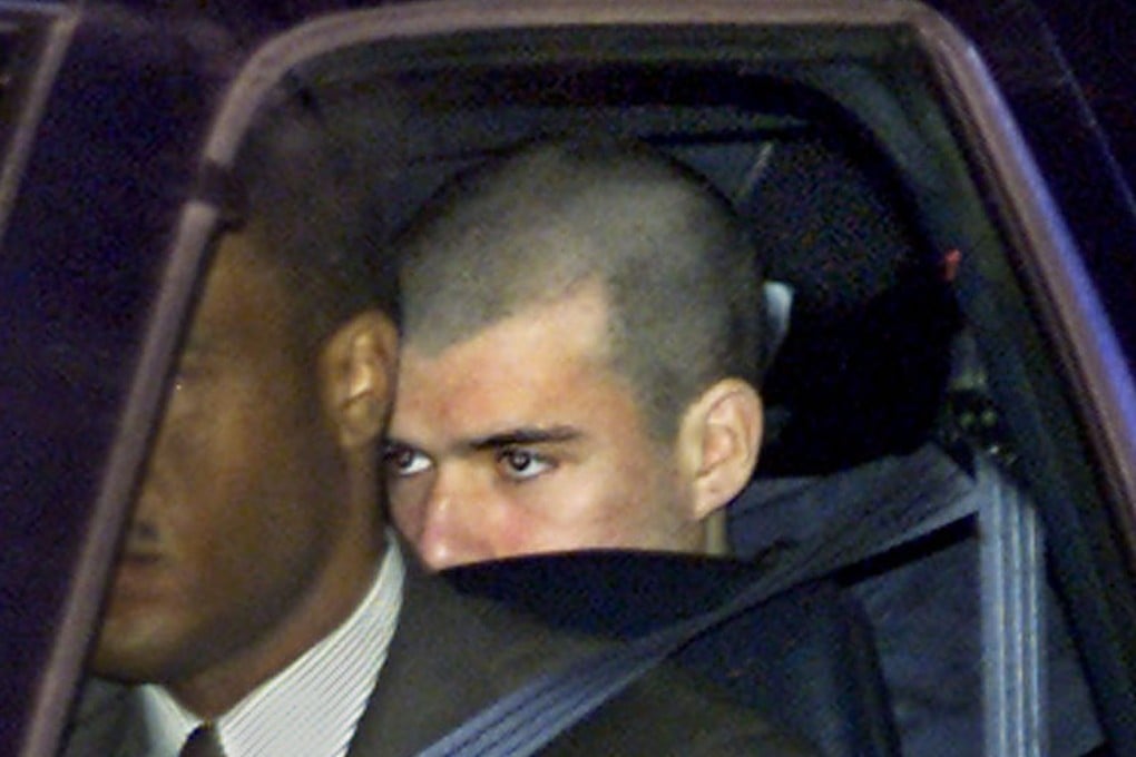 In this Jan. 24, 2002, photo, John Walker Lindh is driven from the Alexandria Detention Center in Virginia. Photo: AP