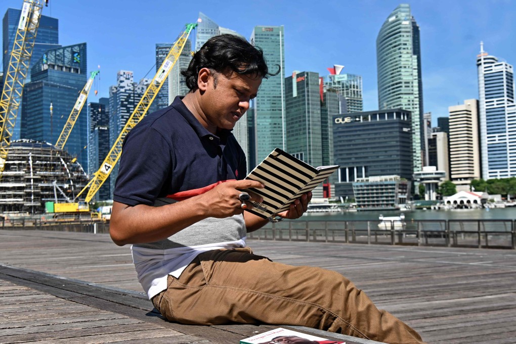 MD Sharif Uddin has published a book about his life in Singapore. Photo: AFP