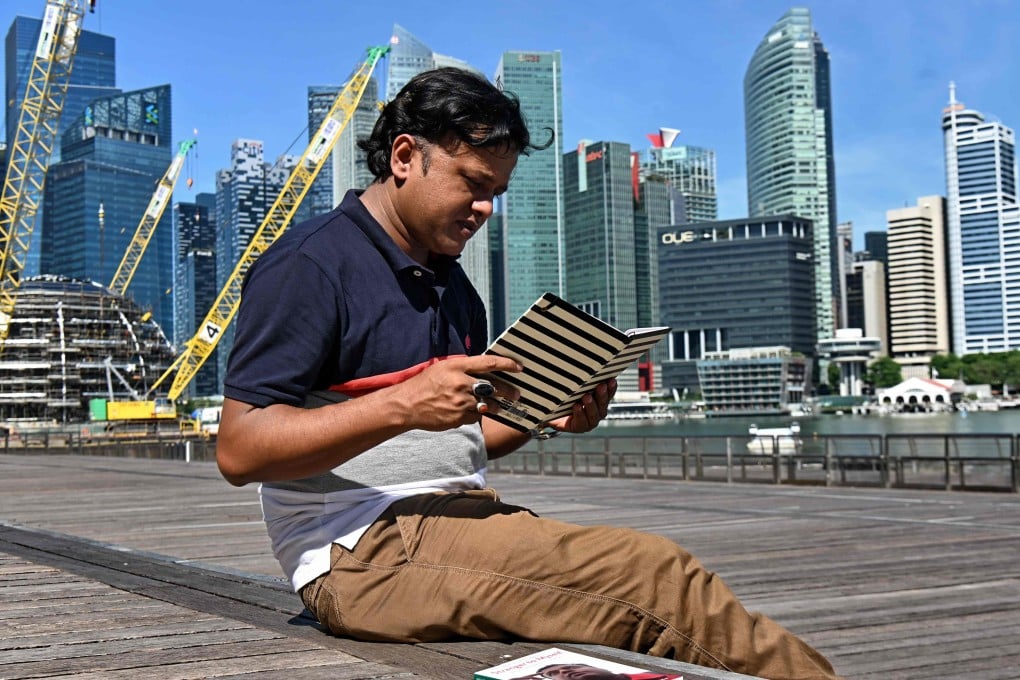 MD Sharif Uddin has published a book about his life in Singapore. Photo: AFP