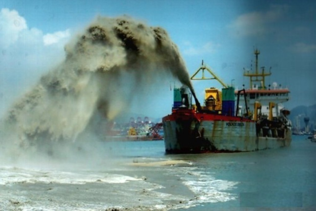 Workers dredged sand to reclaim land for Hong Kong Disneyland in the early 2000s. Photo: Handout
