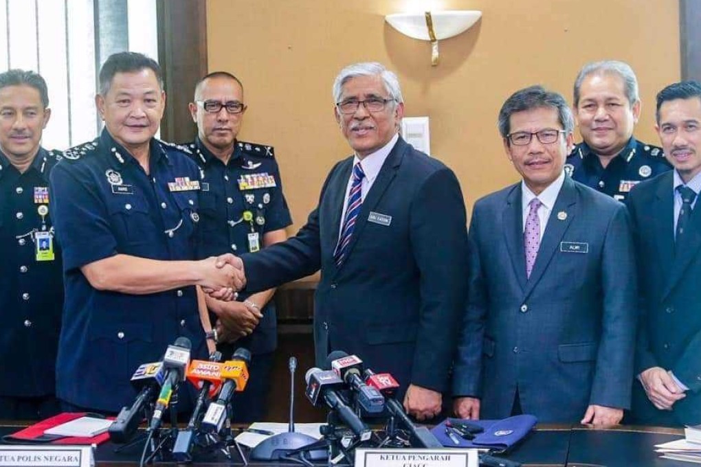 Malaysian anti-corruption adviser Abu Kassim Mohamed with the newly minted police chief Abdul Hamid Bador. Photo: Malaysian Home Ministry
