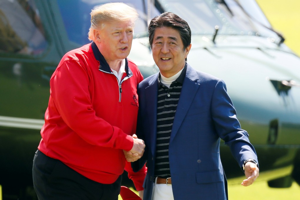 US President Donald Trump is welcomed by Japanese Prime Minister Shinzo Abe as he arrives to play golf at the Mobara Country Club in Mobara, Chiba Prefecture, east of Tokyo, on May 26. Photo: Reuters