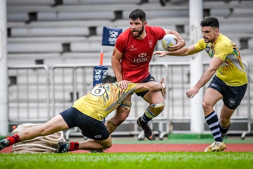 Kane Boucaut tries to break a tackle while playing for the Hong Kong national team against the South China Tigers. Photo: HKFC