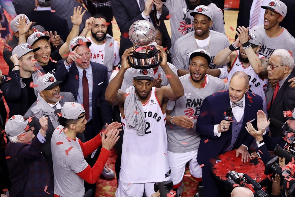 Kawhi Leonard of the Toronto Raptors celebrates with the Eastern Conference trophy after defeating the Milwaukee Bucks 100-94 in game six. Photo: AFP