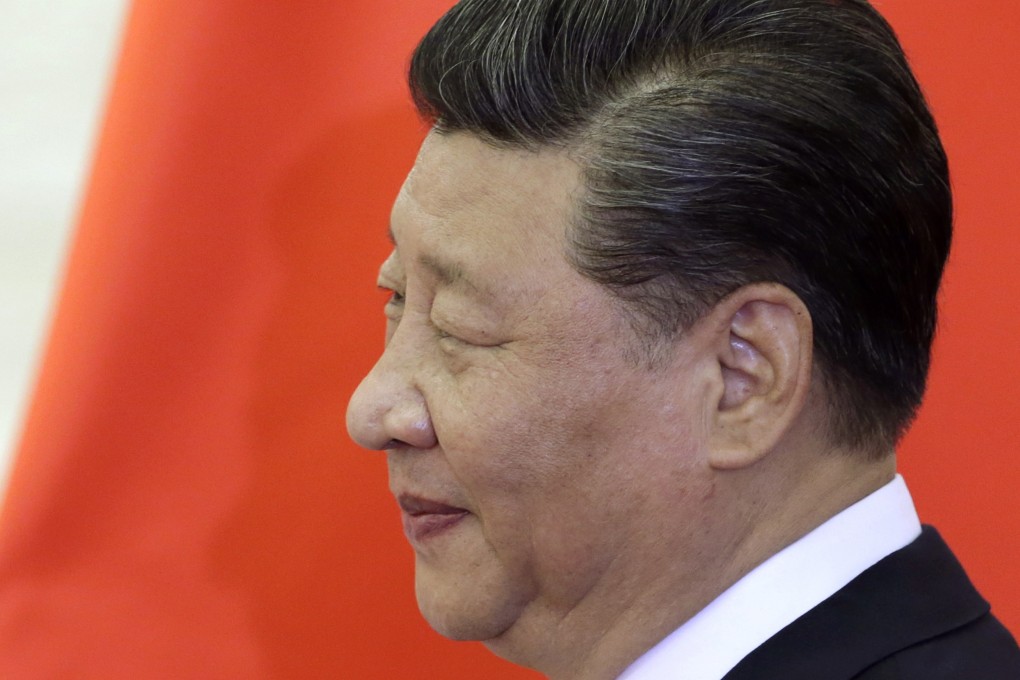 Chinese President Xi Jinping next to a Chinese flag at the Great Hall of the People in May. Photo: Getty Images