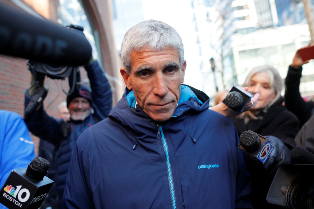 William “Rick” Singer leaves Boston Federal Court after being charged with racketeering conspiracy, money laundering conspiracy, conspiracy to defraud the United States, and obstruction of justice on March 12. Photo: Reuters