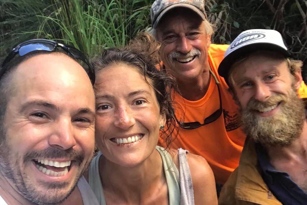 Missing hiker Amanda Eller is seen with her rescuers, (left to right) Javier Cantellops, Troy Helmer and Chris Berquist, on May 24, at Makawao Forest Reserve on the Hawaiian Island of Maui. Photo: Javier Cantellops – facebook.com/AmandaEllersMissing/ via AFP