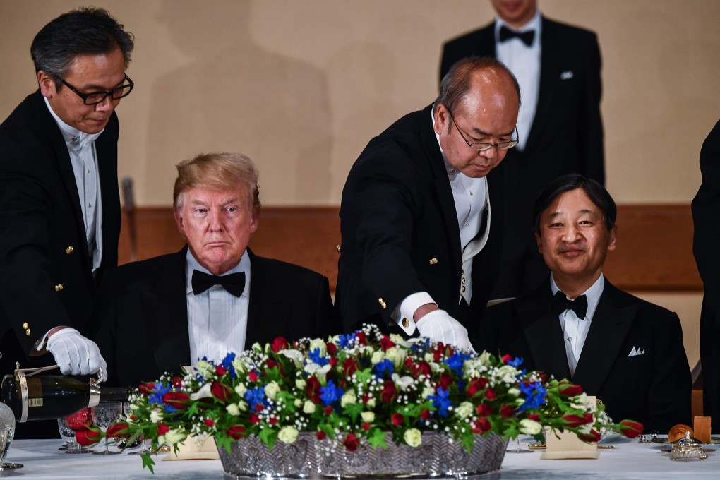 US President Donald Trump (left) and Japan’s Emperor Naruhito attend a state banquet at the Imperial Palace in Tokyo on Monday. Photo: AFP