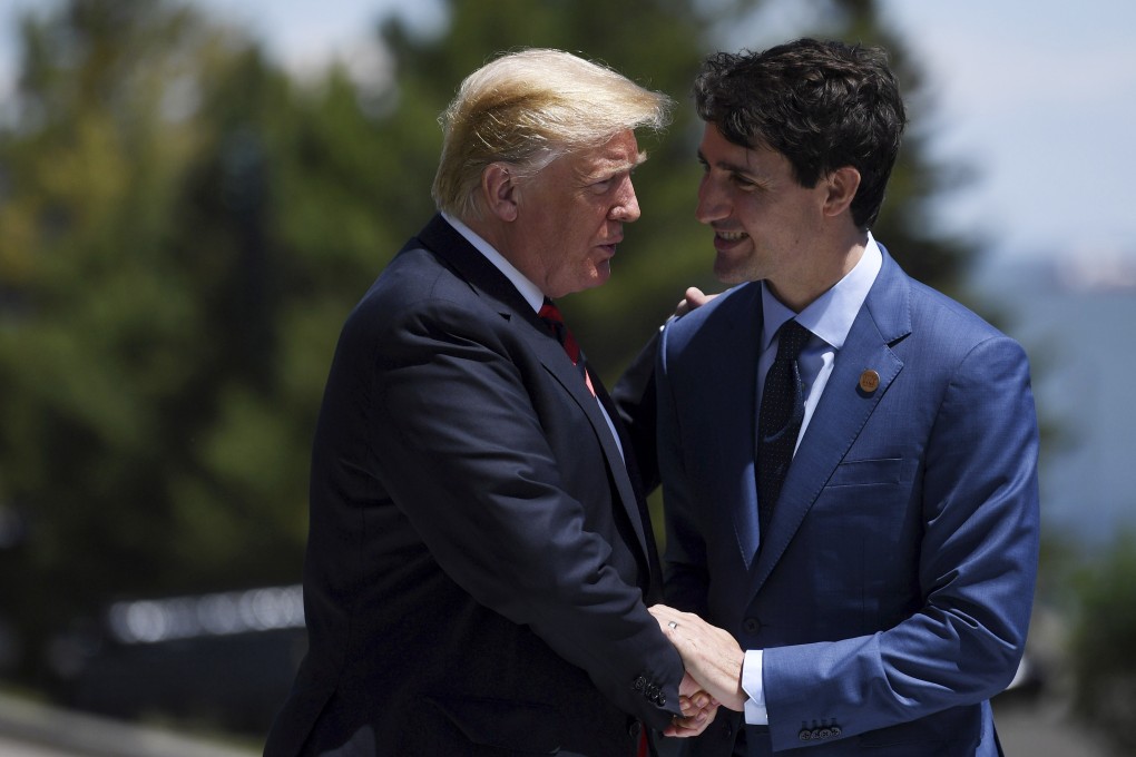 US President Donald Trump (left) and Canada's Prime Minister Justin Trudeau shake hands at the G7 summit in Charlevoix, Canada, in June 2018. Photo: EPA-EFE