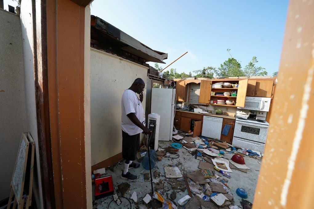 A man stands in what is left of his home following a tornado in Jefferson City, Missouri. Washington’s trade war rhetoric has heated up, possibly to distract the public, even as a series of tornadoes and floods hit the US. Photo: Reuters