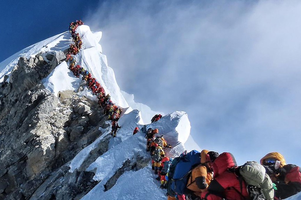 A traffic jam of climbers block the route to and from the summit of Everest, possibly killing Anjali Kulkarni after she spent too long at high altitude. Photo: Project possible