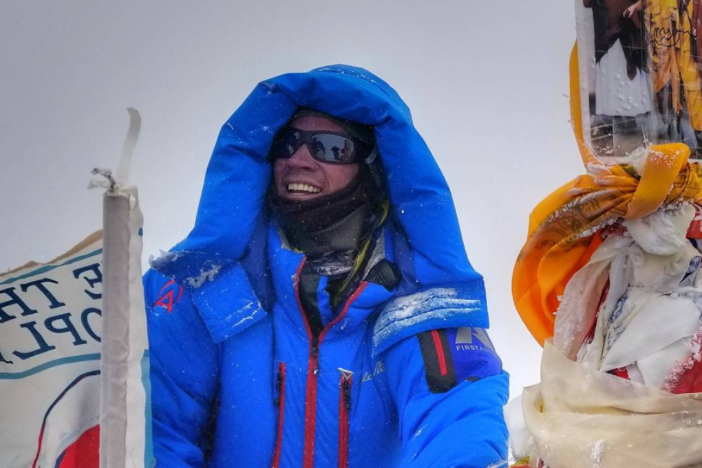 Adrian Ballinger sits atop Everest, becoming one of about 200 climbers to reach the peak without supplementary oxygen. Photo: Handout