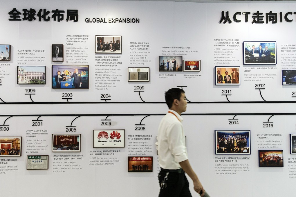 An employee walks past a display detailing Huawei’s history at the company’s training facility in Dongguan, China, on May 23. By targeting Huawei, the US has gone beyond the limits of a trade war. Photo: Bloomberg