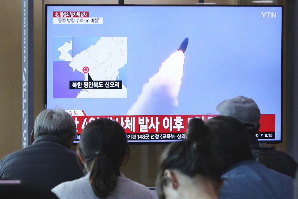 People in Seoul watch television footage of North Korea's missile launch during a news programme on May 9. Photo: AP