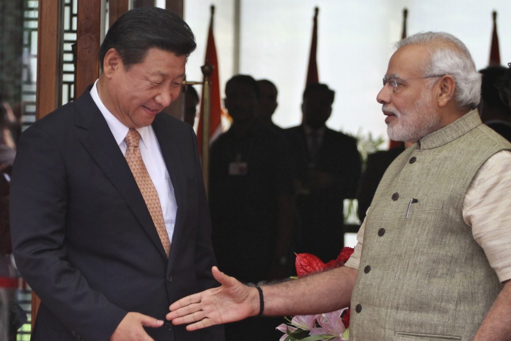 Indian Prime Minister Narendra Modi welcomes Chinese President Xi Jinping in Ahmedabad, India, in 2014. Photo: AP