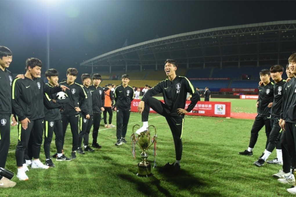 South Korea’s Park places his foot on the Panda Cup trophy after victory over China secures the tournament win in Chengdu. Photo: Handout