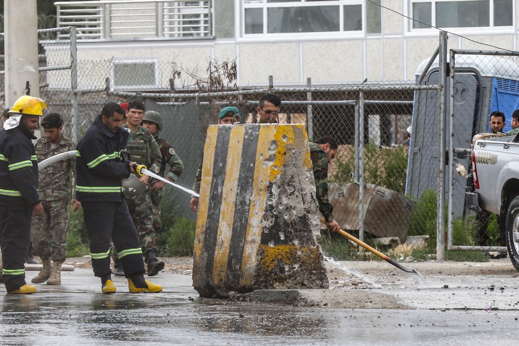 Afghan security forces inspect the scene of a suicide bomber targeted cadets at Marshal Fahim National Defense University in Kabul. Photo: EPA-EFE