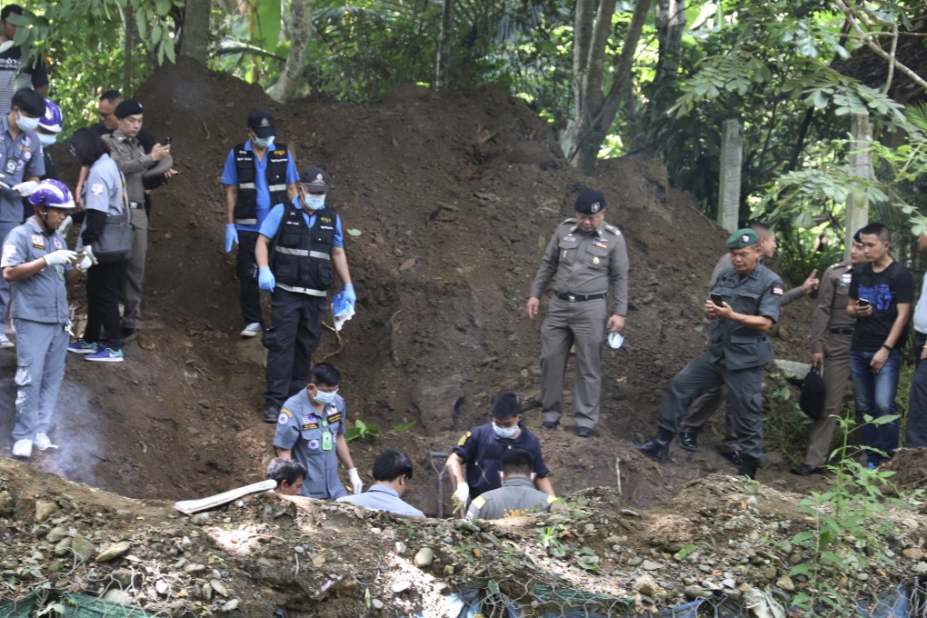 Officers stand by the area where the bodies of a murdered Briton and his wife were found, in Phrae province, Thailand. Photo: AP