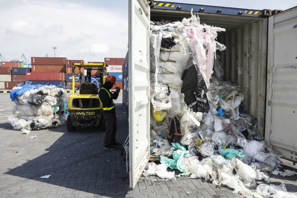Plastic waste is seen inside a cargo container before being sent by Malaysian authorities back to the country of origin in Port Klang, Selangor, Malaysia, on Tuesday. Photo: EPA-EFE
