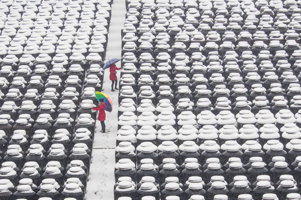 Snow-covered vats at a vinegar and soy sauce mill in Zhenjiang, Jiangsu province. The city is today best known for its production of rice-based black vinegar used in Chinese cuisine. Photo: Reuters