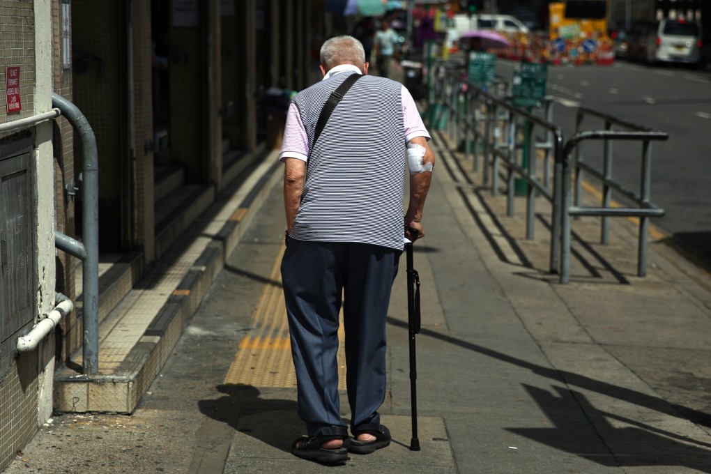 An elderly man walks along a street in Sham Shui Po. A new study has suggested there is a link between hot weather and suicide. Photo: Sam Tsang