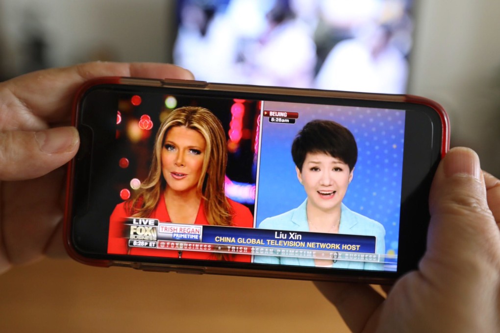Fox Business anchor Trish Regan (left) and CGTN’s Liu Xin, face off in trade war debate on a smartphone in Beijing. Photo: Simon Song