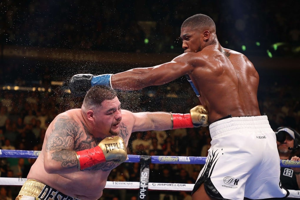 Andy Ruiz Jnr throws a hard left to the body of Anthony Joshua during their heavyweight title fight. Photo: AFP