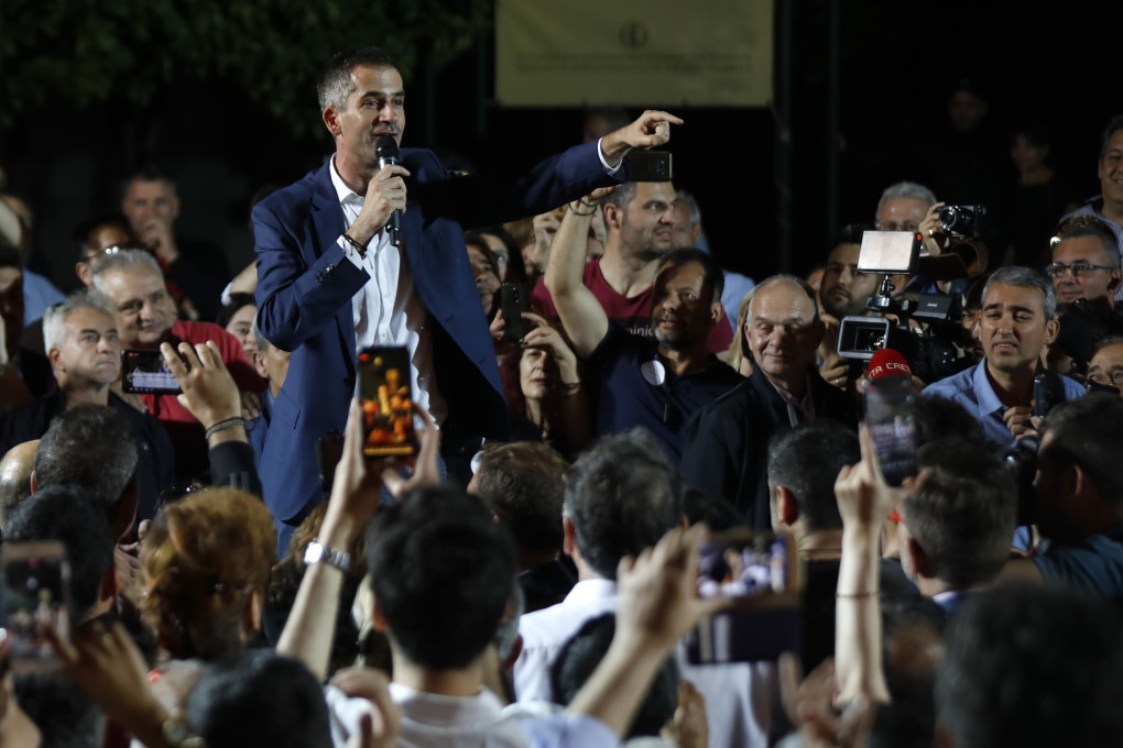 Kostas Bakoyannis the winner of the mayoral race in Athens speaks to supporters after his election victory. Photo: AP Photo