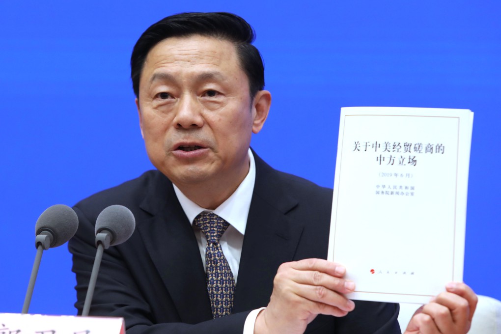 Guo Weimin, vice director of the Information Office of the State Council, announces the council’s paper on the trade war talks with the US on Sunday. Photo: Simon Song
