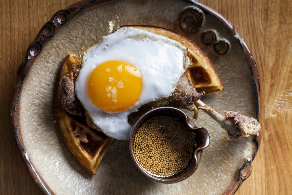 London restaurant Duck & Waffle’s signature dish, confit duck leg on a bed of waffles topped with a fried egg and maple syrup. Photo: Duck & Waffle