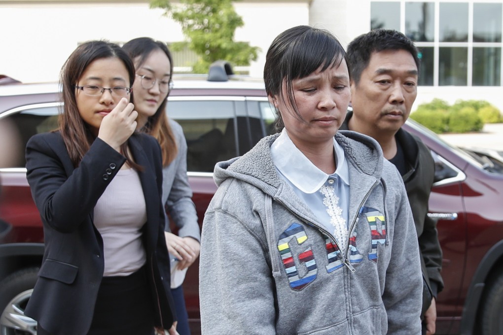 Zhang Yingying’s parents Ye Lifeng (second from right) and Zhang Ronggao (right), arrive at the courthouse as jury selection in the federal trial of Brendt Christensen begins on Monday. Photo: AFP