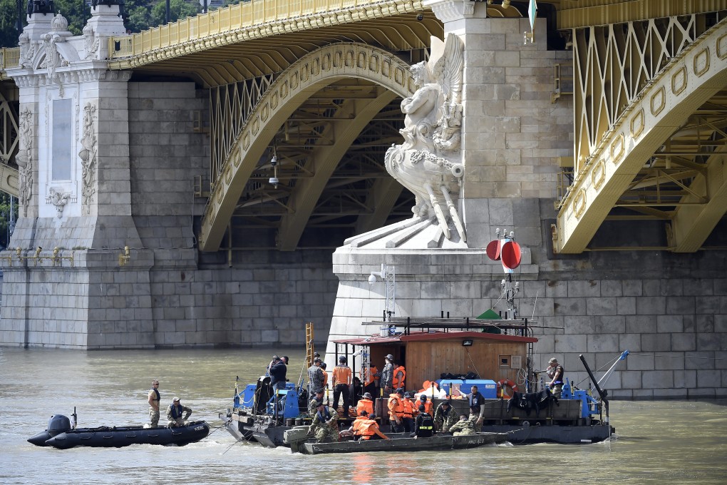 Members of the South Korean rescue team at Margaret Bridge in Budapest on Monday. Photo: EPA-EFE