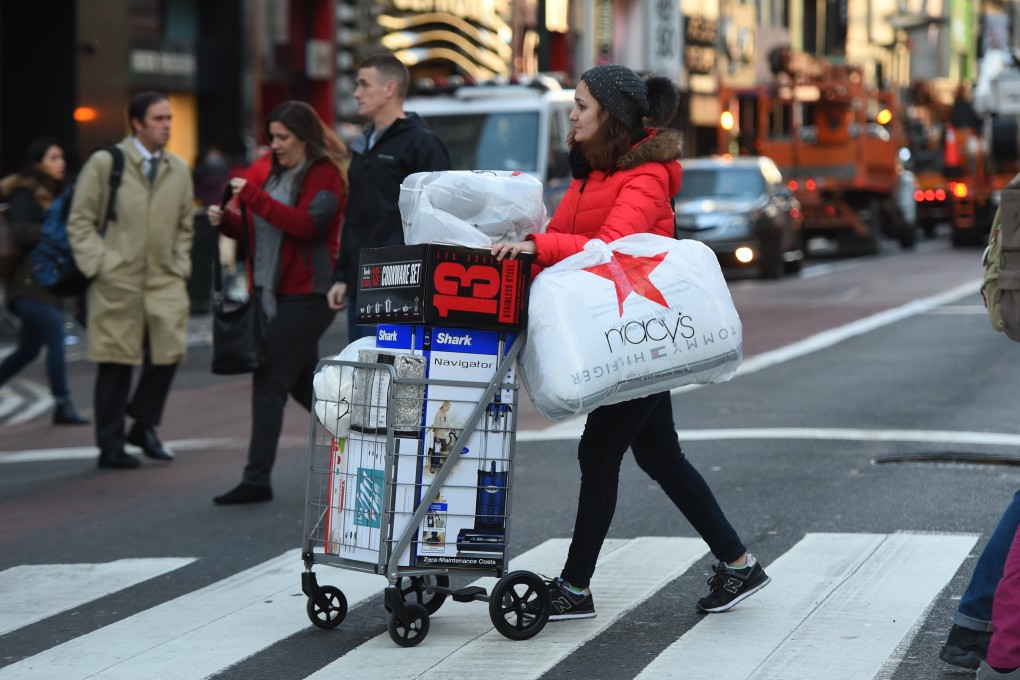 A shopper takes advantage of the Black Friday sales the day after Thanksgiving in New York City on November 24, 2017. Photo: AFP