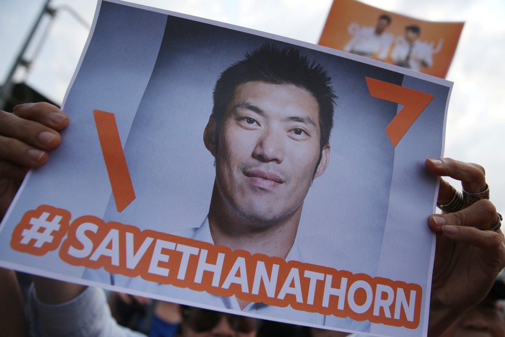 A supporter of Thanathorn holds up a placard in Bangkok. Photo: Reuters