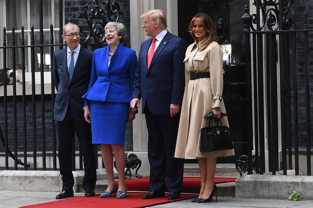 US president Donald Trump and his wife Melania (right) are welcomed by Britain's Prime Minister Theresa May and her husband Philip May (left) at 10 Downing Street in London. Photo: EPA-EFE