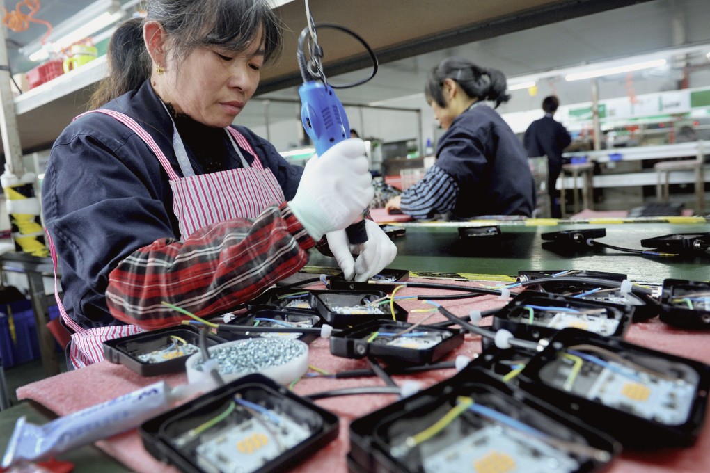 The forecast is still within the growth target range of 6 per cent to 6.5 per cent set by Beijing in March. Photo: AP