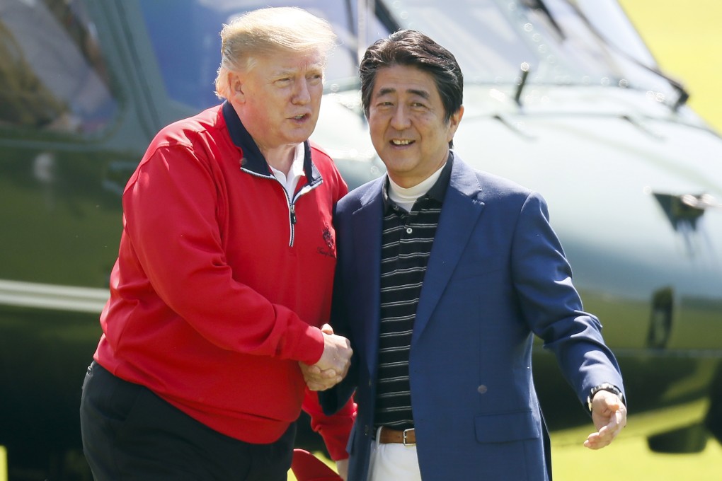 US President Donald Trump is welcomed by Japanese Prime Minister Shinzo Abe at Mobara Country Club, south of Tokyo, on May 26. Photo: AP