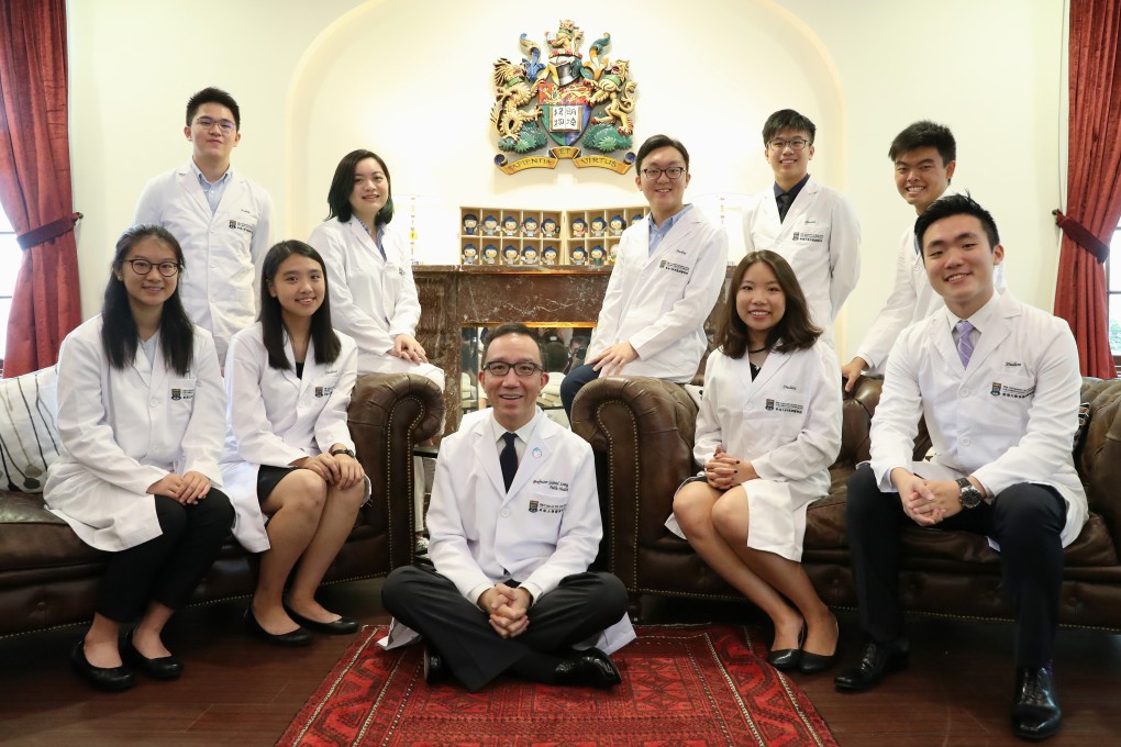 Hong Kong Diploma of Secondary Education exam top scorers about to join the University of Hong Kong’s faculty of medicine pose with Professor Gabriel Leung, dean of the school, in August 2018. Photo: K.Y. Cheng