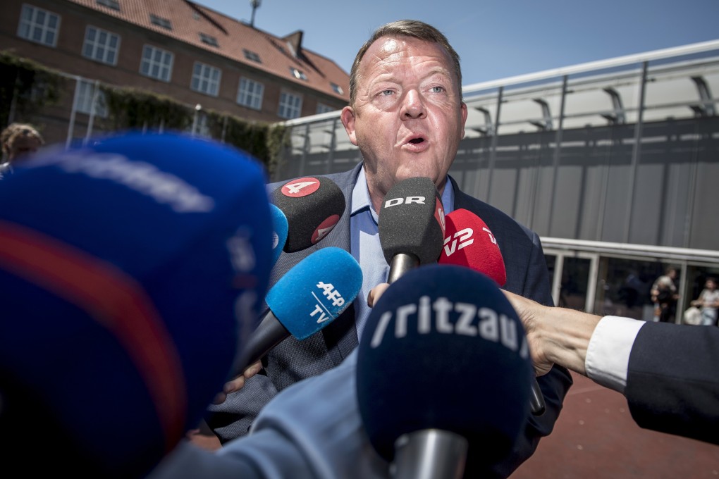 Danish Prime Minister Lars Lokke Rasmussen speaks to journalists outside his local polling station in Denmark on Wednesday. Photo: EPA-EFE