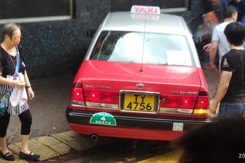A taxi pictured after mounting the pavement on Tai Po Road in Sham Shui Po on Thursday. The taxi driver had swerved to avoid hitting a man in a wheelchair. Photo: Facebook