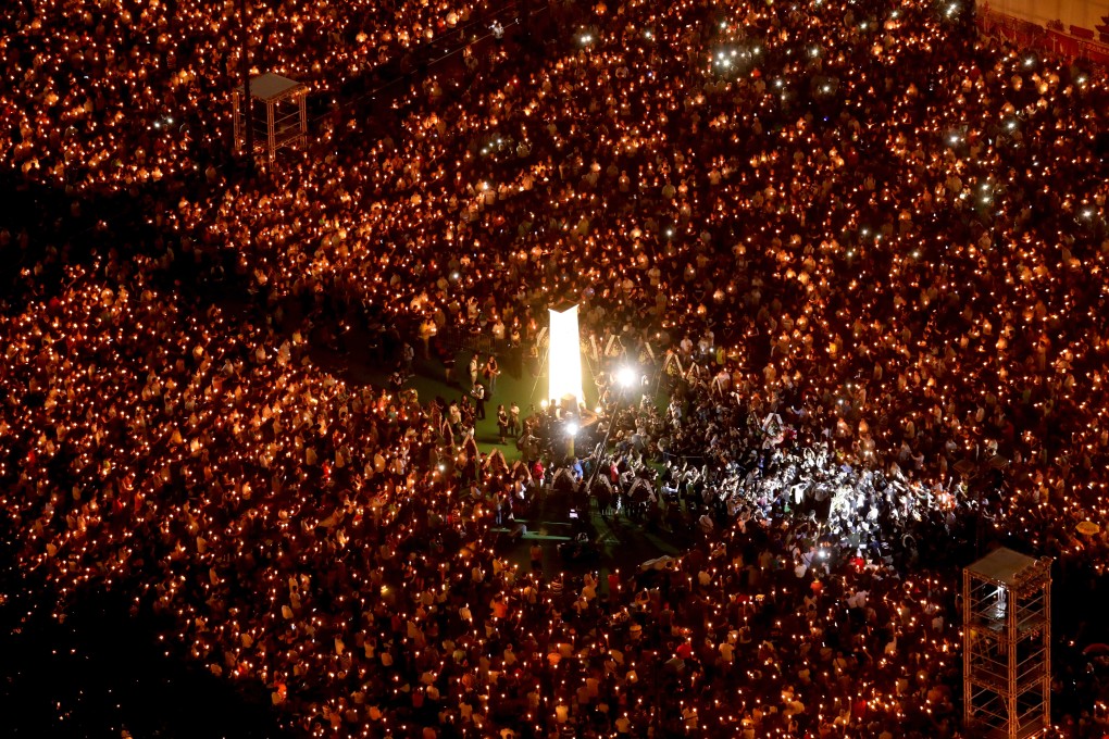 People raise candles during the June 4 vigil at Victoria Park in Causeway Bay. Photo: Dickson Lee