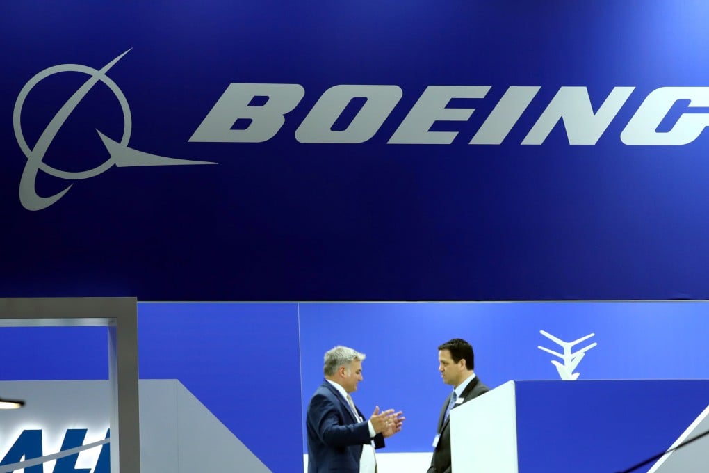 Visitors talk at the Boeing stand during the European Business Aviation Convention and Exhibition (EBACE) at Cointrin Airport in Geneva in May. Photo: Reuters
