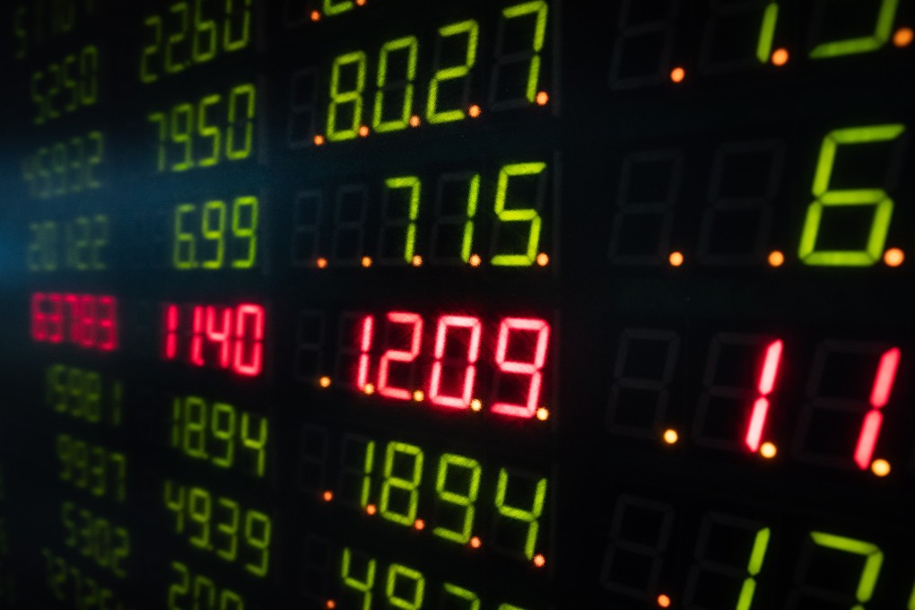 An electronic board displays stock prices at a securities brokerage in Beijing. Cases of fraud in corporate disclosure have often rocked confidence in the market. Photo: EPA