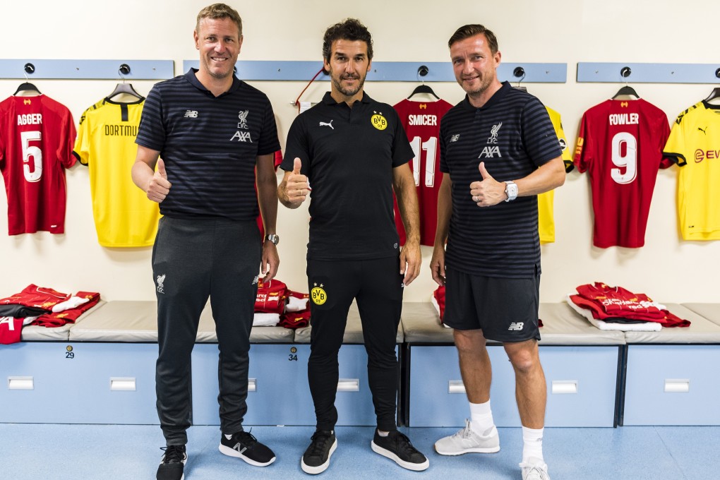 Liverpool FC Legend Stephane Henchoz and Vladimir Smicer flank Borussia Dortmund Legend Karl-Heinz Riedle before the charity match on Saturday at Hong Kong Stadium. Photo: Liverpool FC via Getty Images