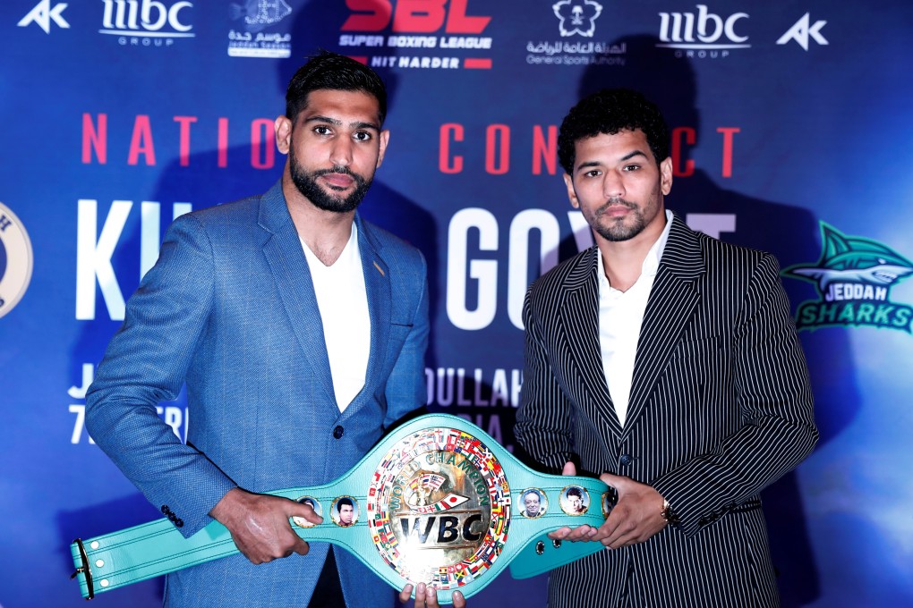 Amir Khan and Neeraj Goyat pose at a media conference to announce their controversial July fight. Photo: Reuters